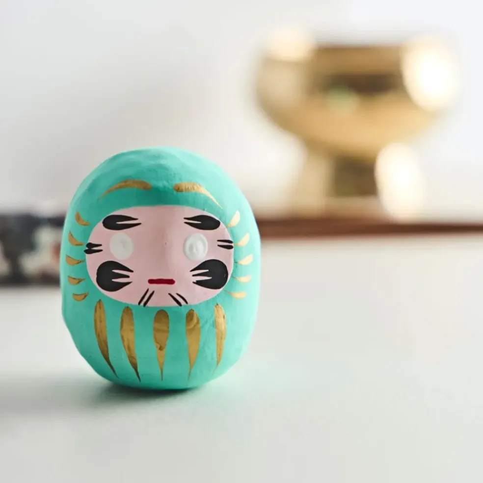 Petit daruma turquoise réussite scolaire